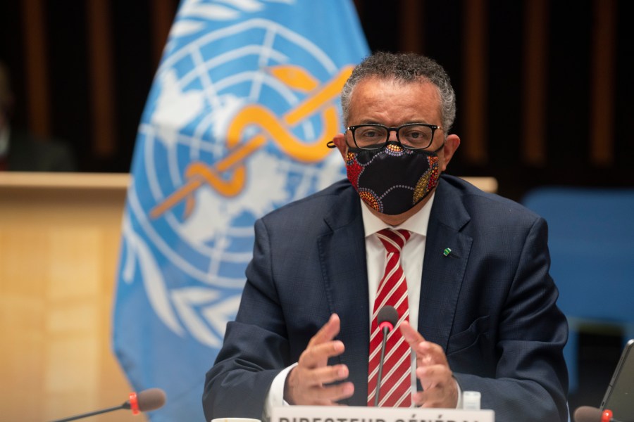 In this photo released by WHO, World Health Organization on Monday, Oct. 5, 2020, WHO Director-General, Dr Tedros Adhanom Ghebreyesus, wearing a mask to protect against coronavirus, gestures during a special session on the COVID-19 response. (Christopher Black/WHO via AP)