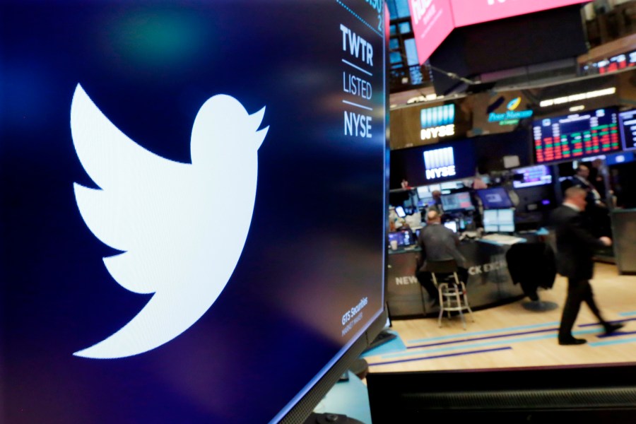 In this Feb. 8, 2018, file photo, the logo for Twitter is displayed above a trading post on the floor of the New York Stock Exchange. Twitter is imposing new rules, Friday, Oct. 9, 2020, ahead of the U.S. presidential election, prohibiting people, including candidates, from claiming an election win before it is called by either state election officials or two authoritative, national news outlets. (AP Photo/Richard Drew, File)