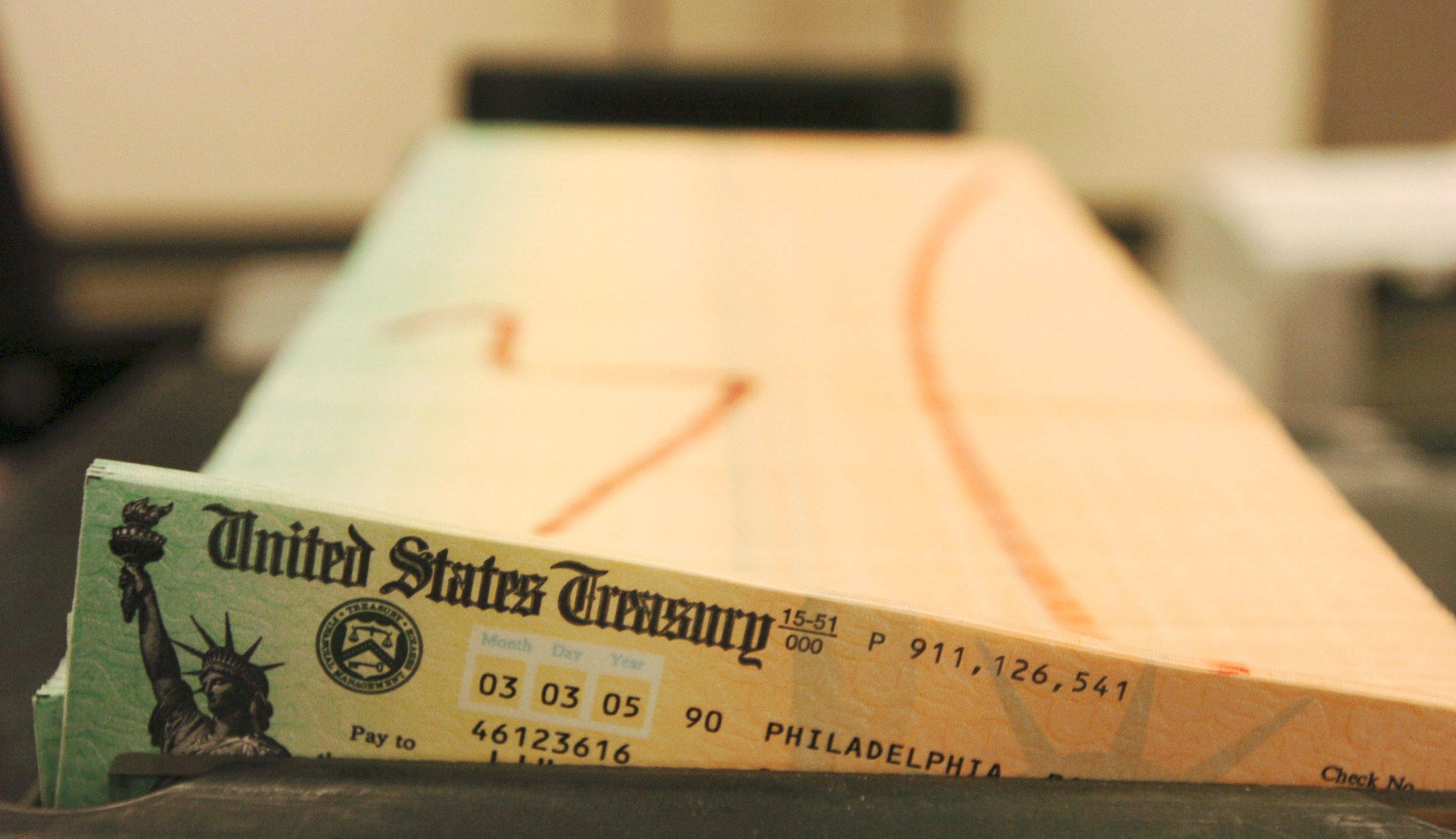 In this Feb. 11, 2005 file photo, trays of printed social security checks wait to be mailed from the U.S. Treasury's Financial Management services facility in Philadelphia. (AP Photo/Bradley C. Bower, File)