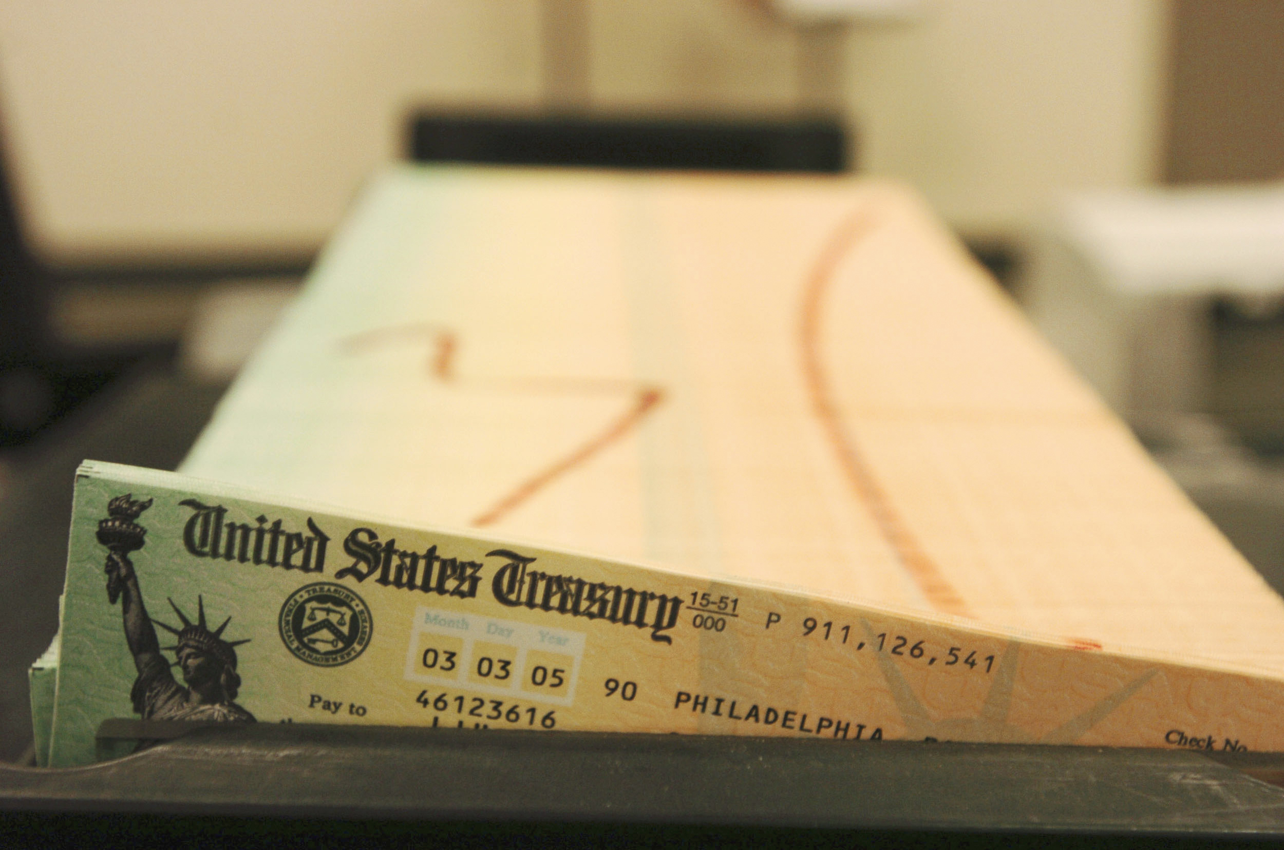 In this Feb. 11, 2005 file photo, trays of printed social security checks wait to be mailed from the U.S. Treasury's Financial Management services facility in Philadelphia. (AP Photo/Bradley C. Bower, File)