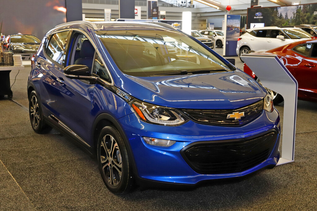 In this Feb. 13, 2020 file photo a 2020 Chevrolet Bolt EV is displayed at the 2020 Pittsburgh International Auto Show in Pittsburgh. (AP Photo/Gene J. Puskar, File)