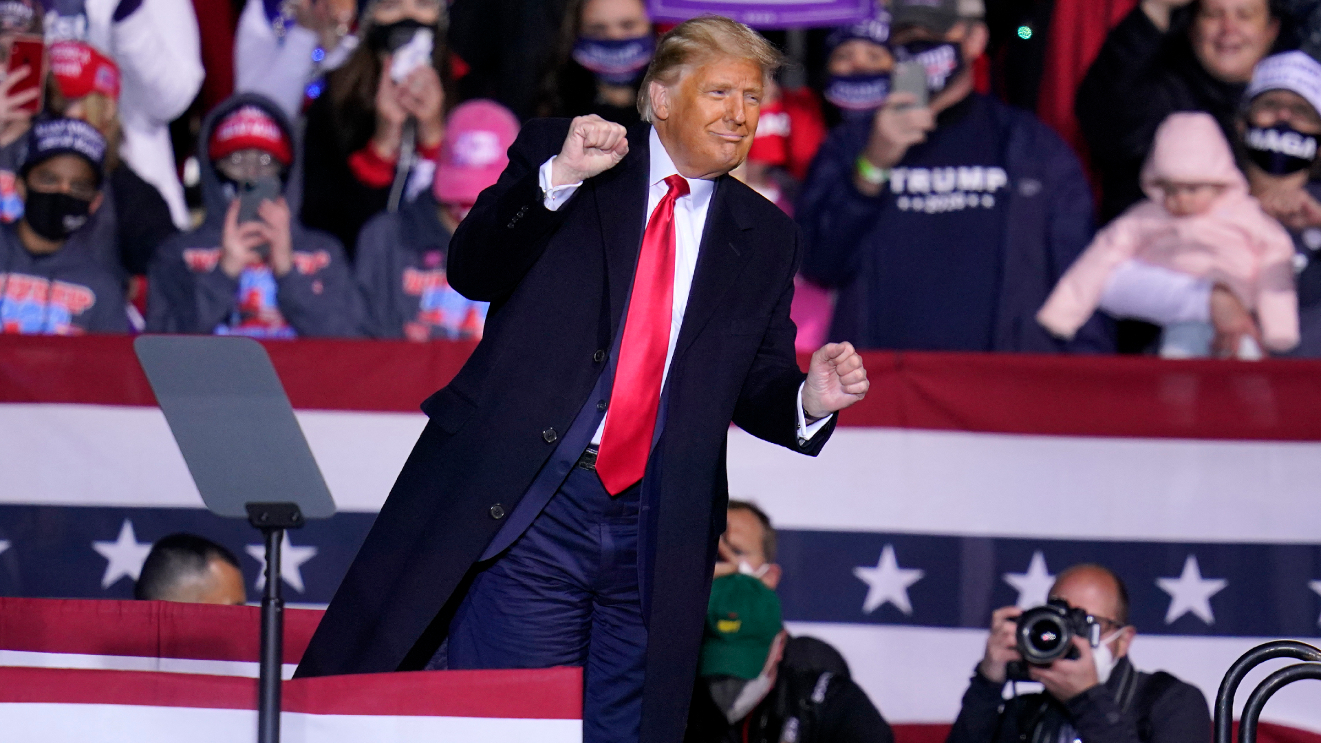 President Donald Trump moves to the song YMCA as he finishes a campaign rally at John P. Murtha Johnstown-Cambria County Airport in Johnstown, Pennsylvania, on Oct. 13, 2020. (Gene J. Puskar / Associated Press)