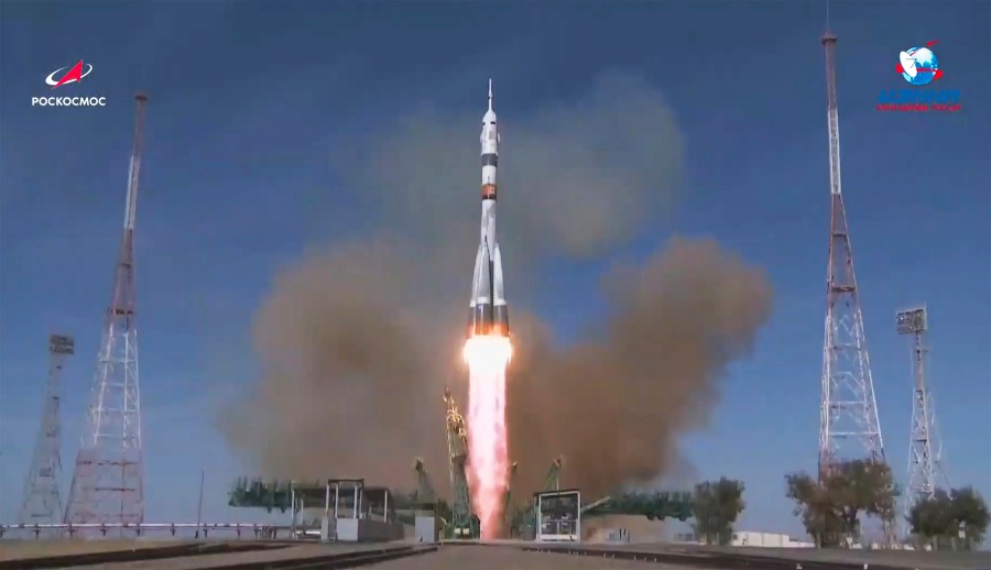 In this image made from video footage released by Roscosmos Space Agency, the Soyuz-2.1a rocket booster with Soyuz MS-17 space ship carrying a new crew to the International Space Station (ISS), blasts off at the Russian leased Baikonur cosmodrome, Kazakhstan, Wednesday, Oct. 14, 2020. (Roscosmos Space Agency via AP)