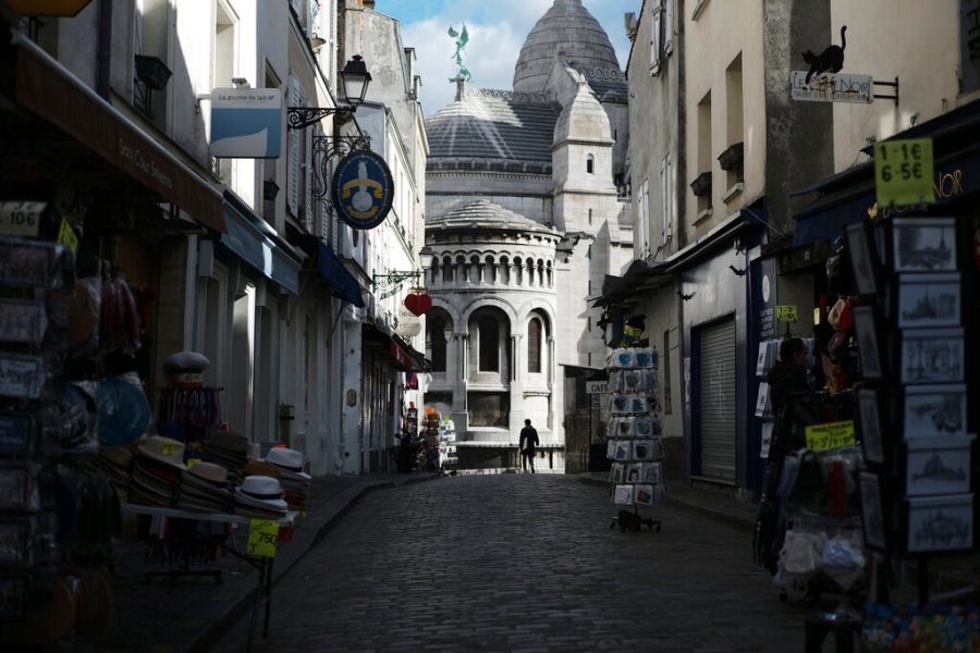 Tourists shops are empty in a deserted street just outside the Sacre Coeur basilica in the Montmartre district of Paris on Oct. 15, 2020. (AP Photo/Lewis Joly)