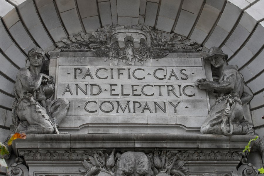 In this April 16, 2020, file photo, a Pacific Gas & Electric sign is displayed on the exterior of a PG&E building in San Francisco. (AP Photo/Jeff Chiu, File)