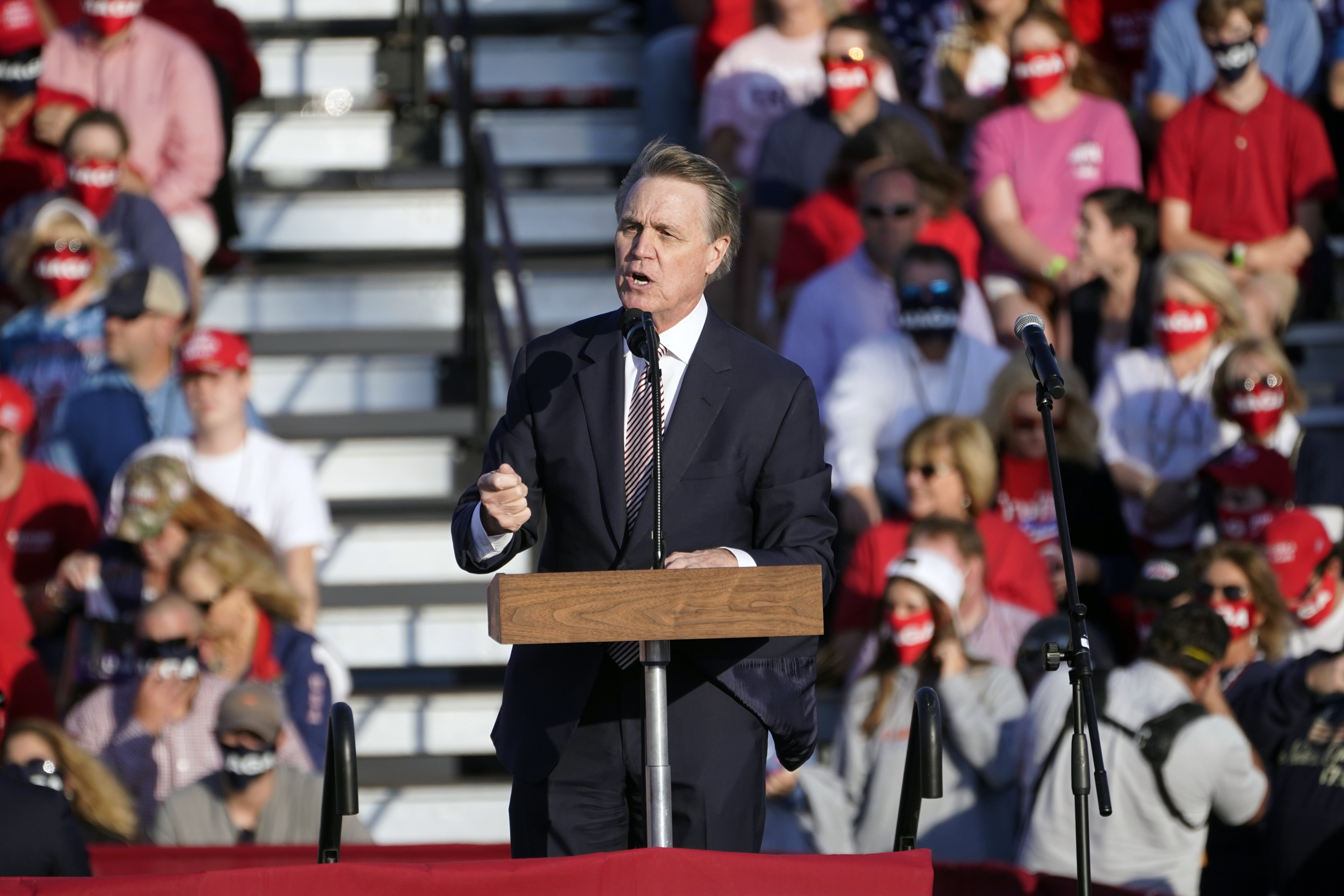 Sen. David Perdue of Georgia speaks during a campaign rally for President Donald Trump at Middle Georgia Regional Airport in Macon on Oct. 16, 2020. (John Bazemore / Associated Press)