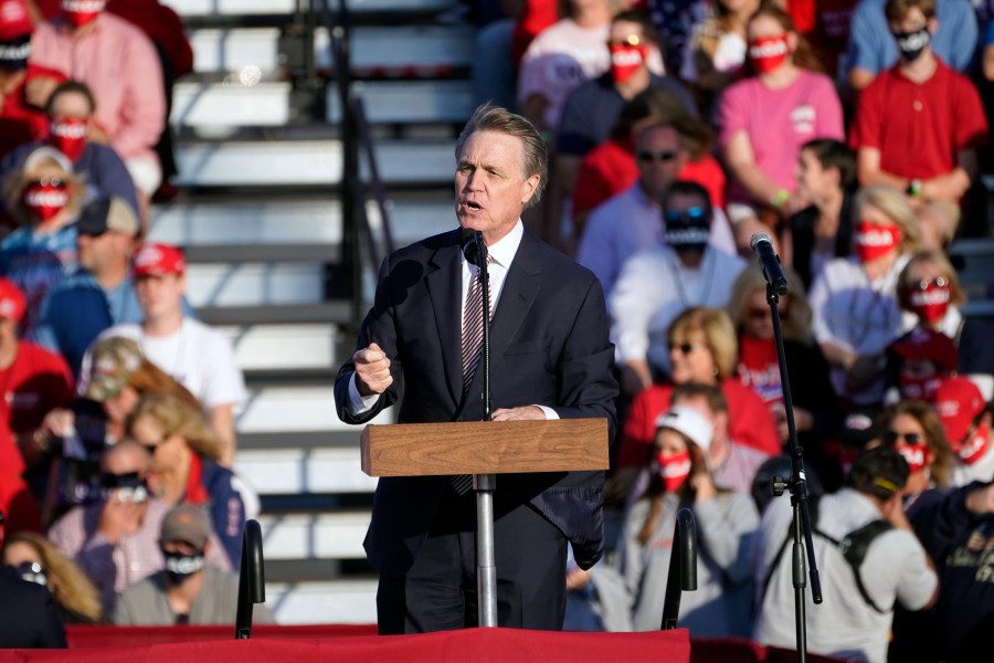 Sen. David Perdue of Georgia speaks during a campaign rally for President Donald Trump at Middle Georgia Regional Airport in Macon on Oct. 16, 2020. (John Bazemore / Associated Press)