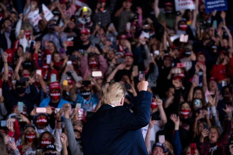 Donald Trump arrives to speak to a campaign rally at Middle Georgia Regional Airport, Friday, Oct. 16, 2020, in Macon, Ga. (AP Photo/Evan Vucci)