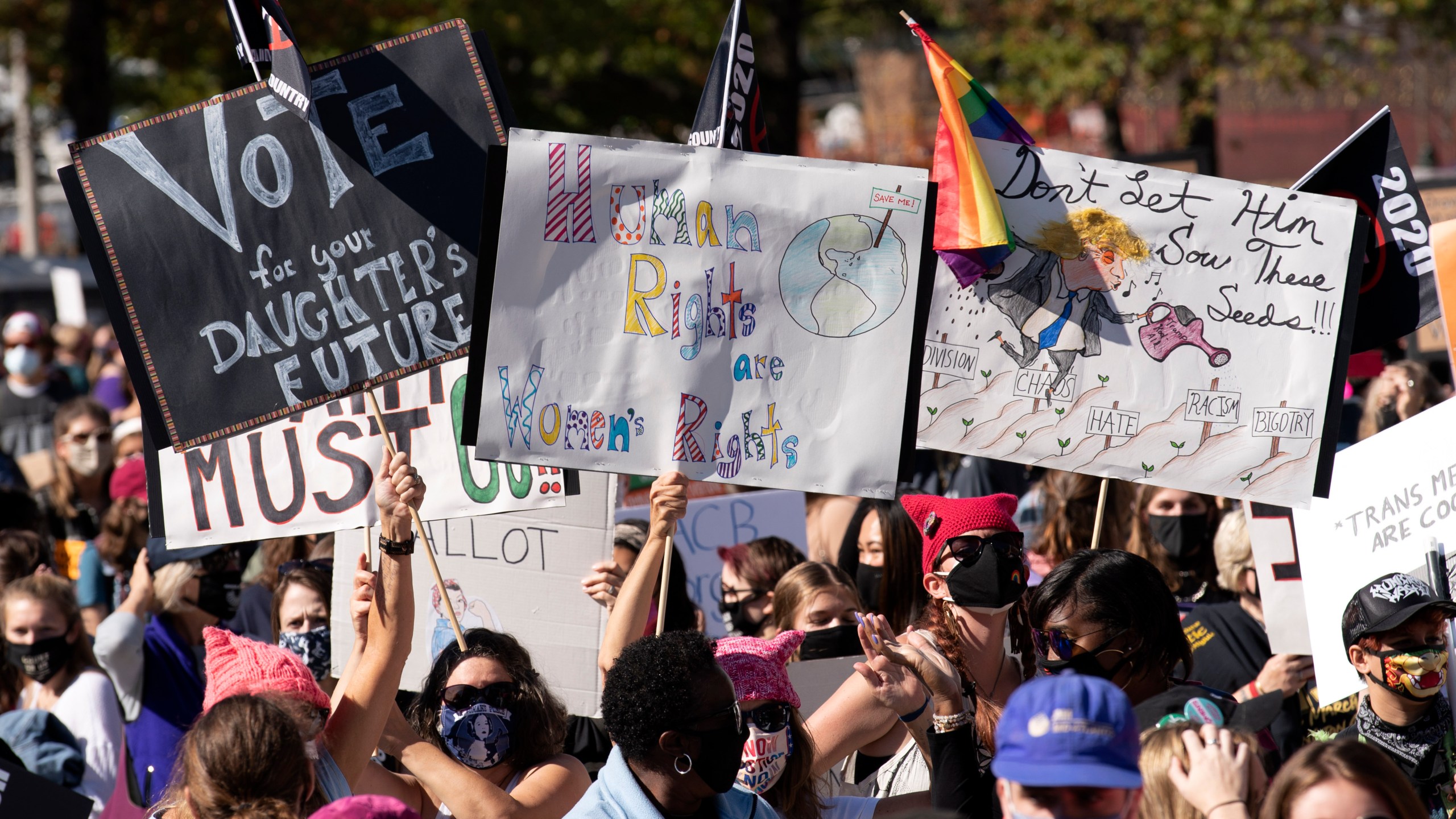 Protestors rally during the Women's March at Freedom Plaza, Saturday, Oct. 17, 2020, in Washington. (AP Photo/Jose Luis Magana)