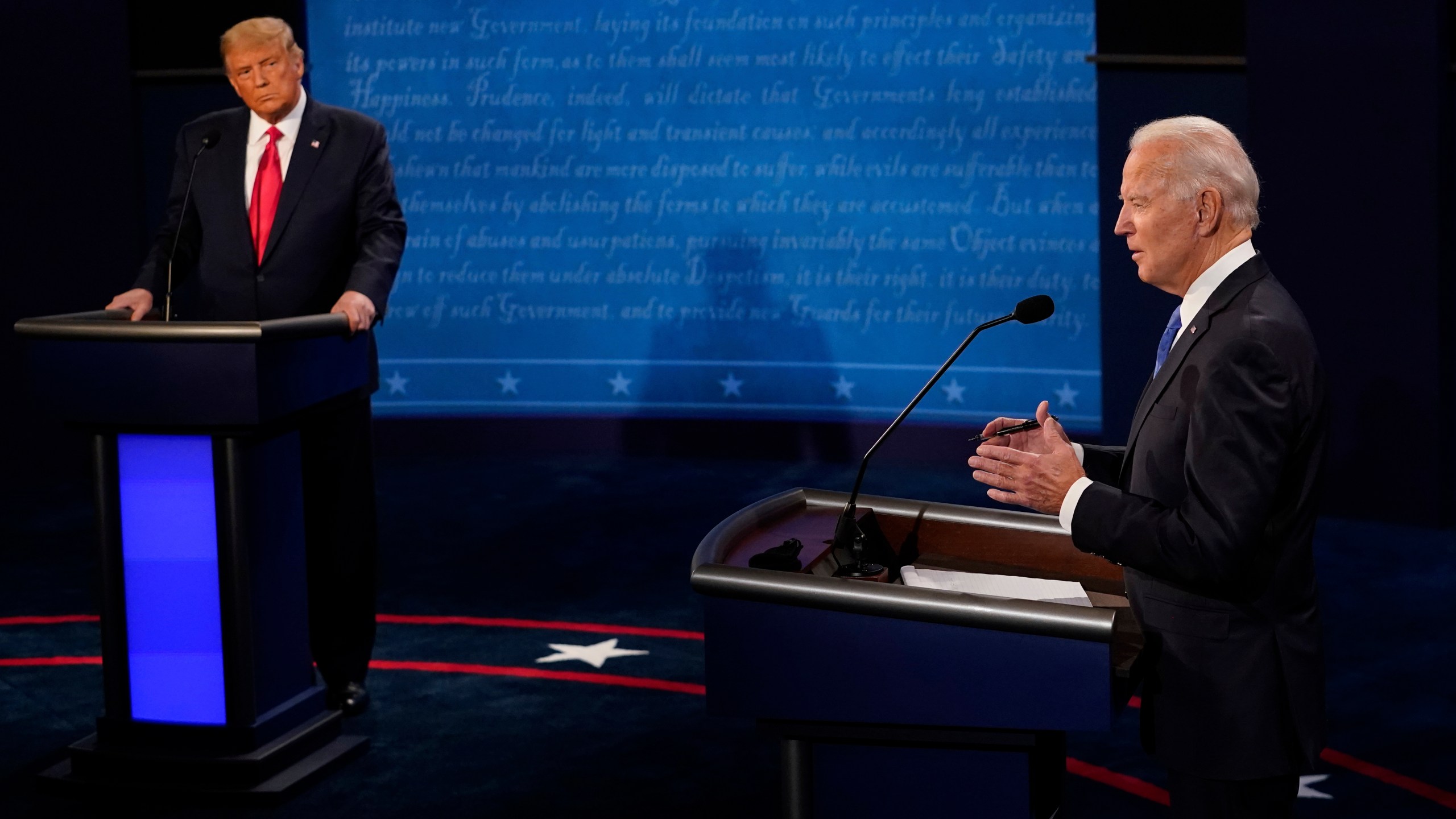 Democratic presidential candidate former Vice President Joe Biden answers a question as President Donald Trump listens during the second and final presidential debate Oct. 22, 2020, at Belmont University in Nashville, Tennessee. (Morry Gash / Associated Press)