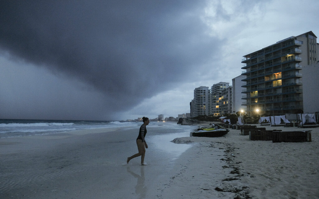 Clouds gather over Playa Gaviota Azul as Tropical Storm Zeta approaches Cancun, Mexico, Monday, Oct. 26, 2020. (AP Photo/Victor Ruiz Garcia)