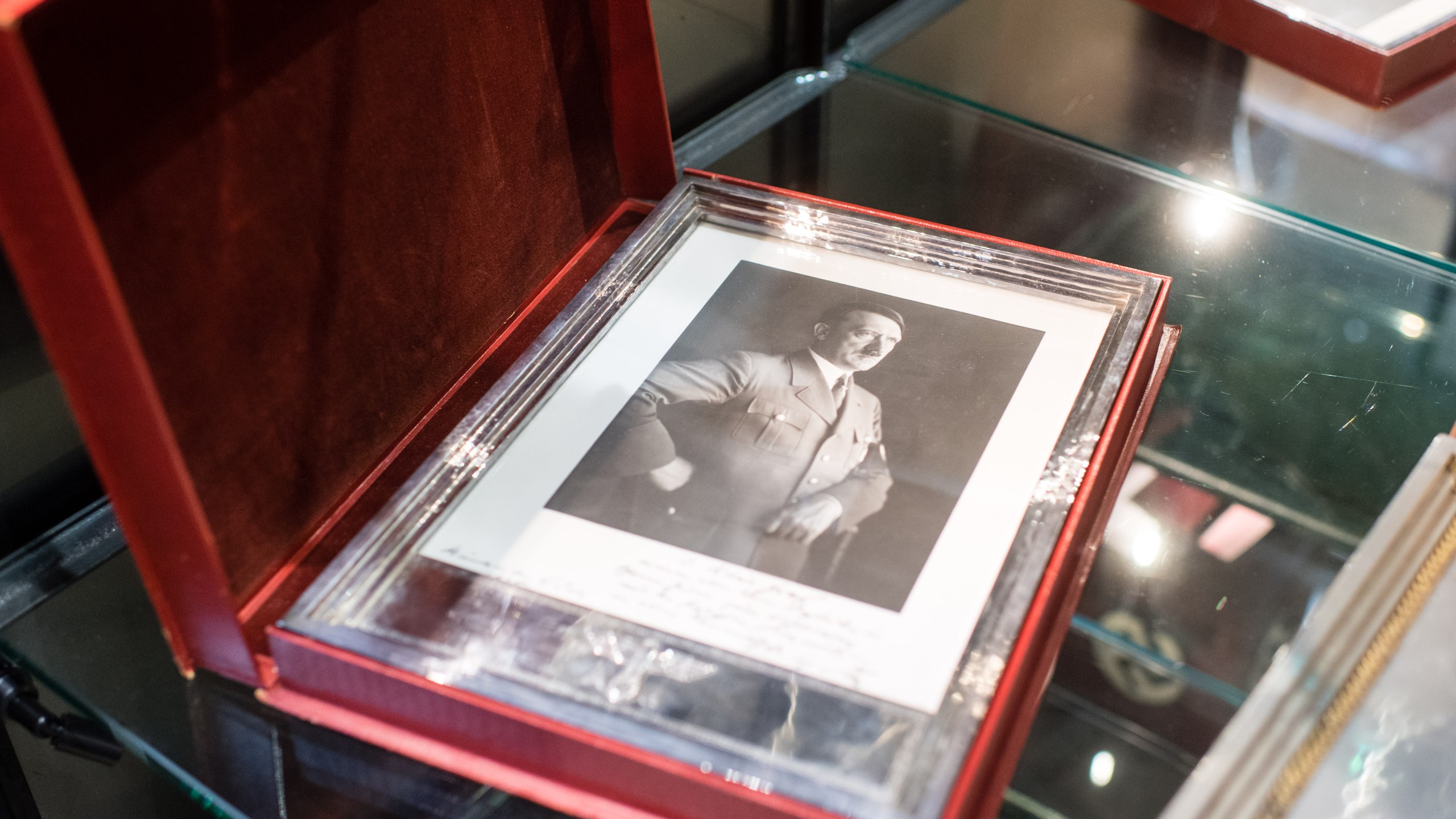 A framed portrait of Adolf Hitler is pictured on Nov. 20, 2019 at the Hermann Historica auction house in Grasbrunn near Munich, southern Germany, prior to an auction of personal belongings from German dictator Adolf Hitler and other notorious World War II Nazi leaders. (MATTHIAS BALK/dpa/AFP via Getty Images)