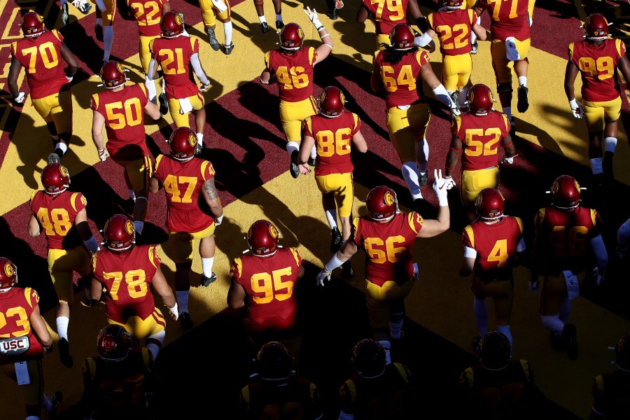 The USC Trojans run onto the field prior to a game against the UCLA Bruins at Los Angeles Memorial Coliseum on Nov. 23, 2019, in Los Angeles. (Sean M. Haffey/Getty Images)