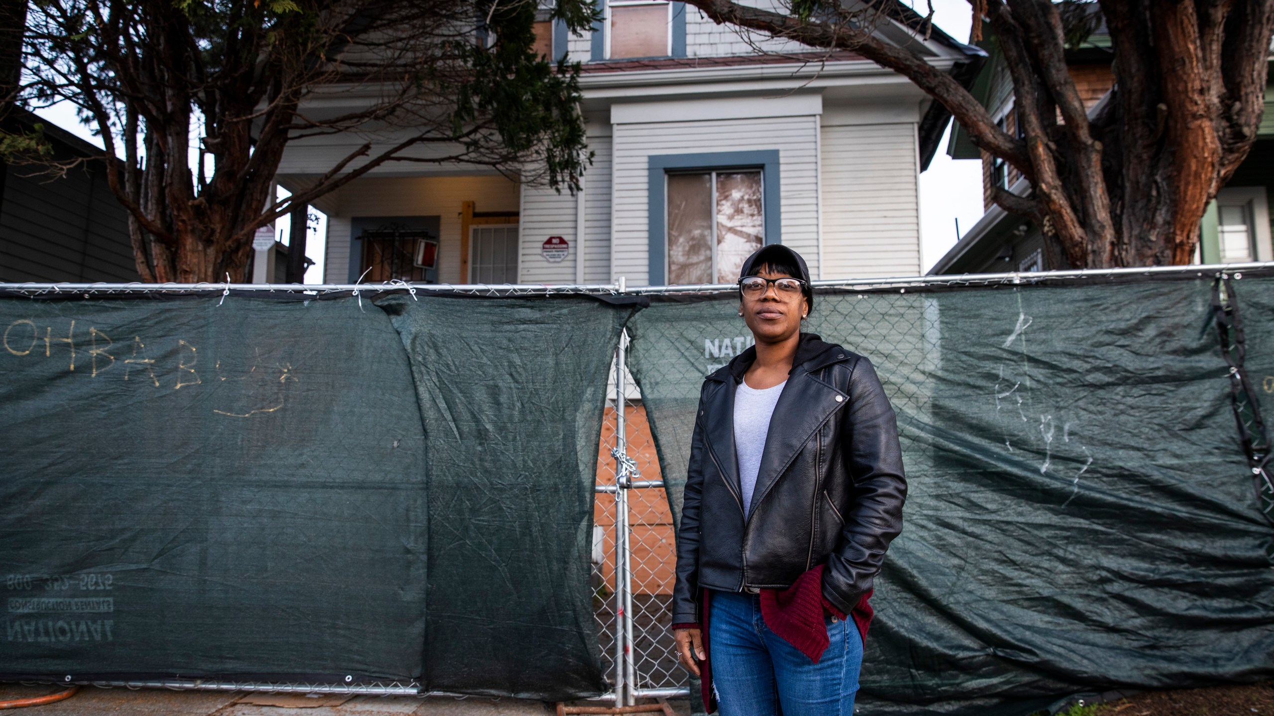 Moms 4 Housing activist Misty Cross stands for a portrait in front of the fenced-off vacant home that she and other homeless or insecurely housed mothers occupied during a months-long protest which ended in a court ordered eviction, in Oakland, California on Jan. 28, 2020. (PHILIP PACHECO/AFP via Getty Images)