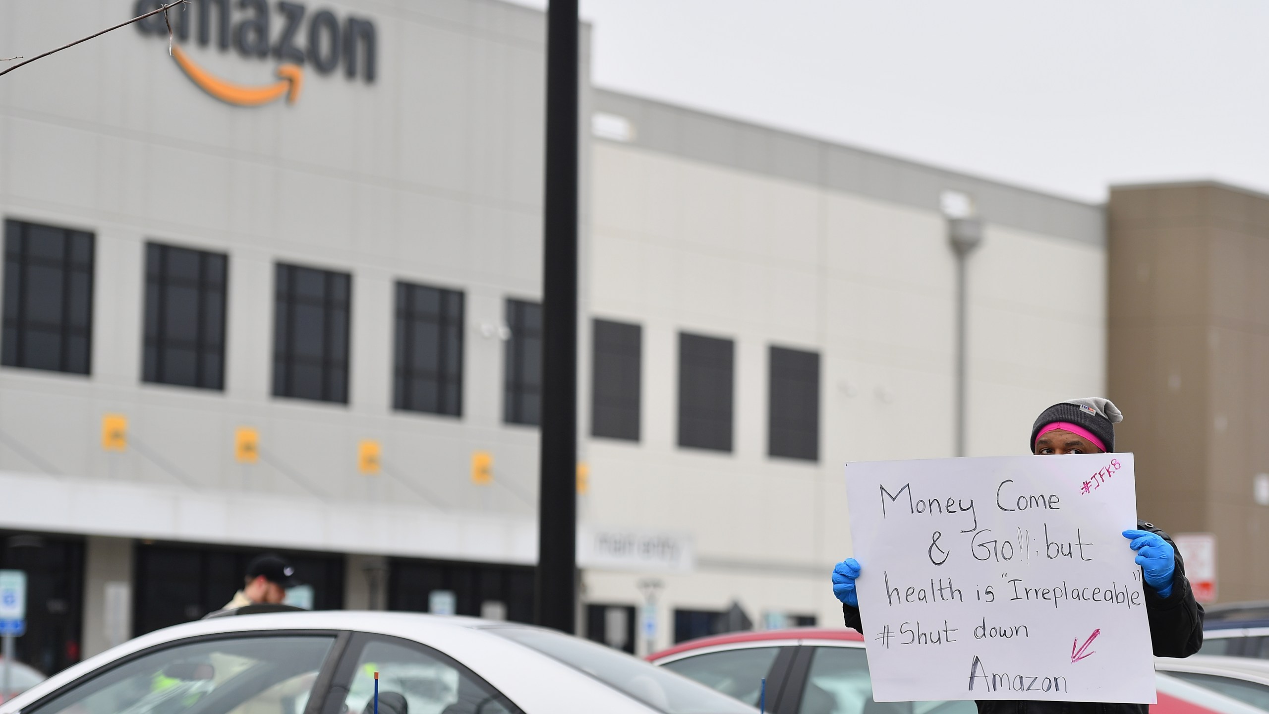 Workers at Amazon's Staten Island warehouse strike in demand that the facility be shut down and cleaned after one staffer tested positive for the coronavirus on March 30, 2020. (Angela Weiss / AFP / Getty Images)