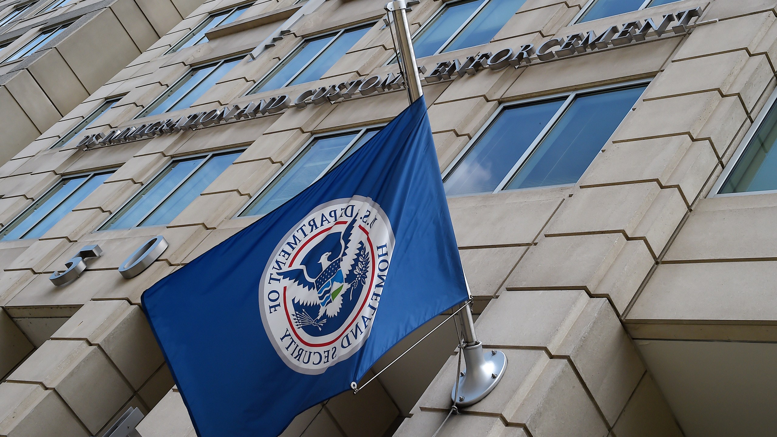 The Department of Homeland Security flag flies outside the Immigration and Customs Enforcement headquarters in Washington, DC, on July 17, 2020. (Olivier Douliery/AFP via Getty Images)