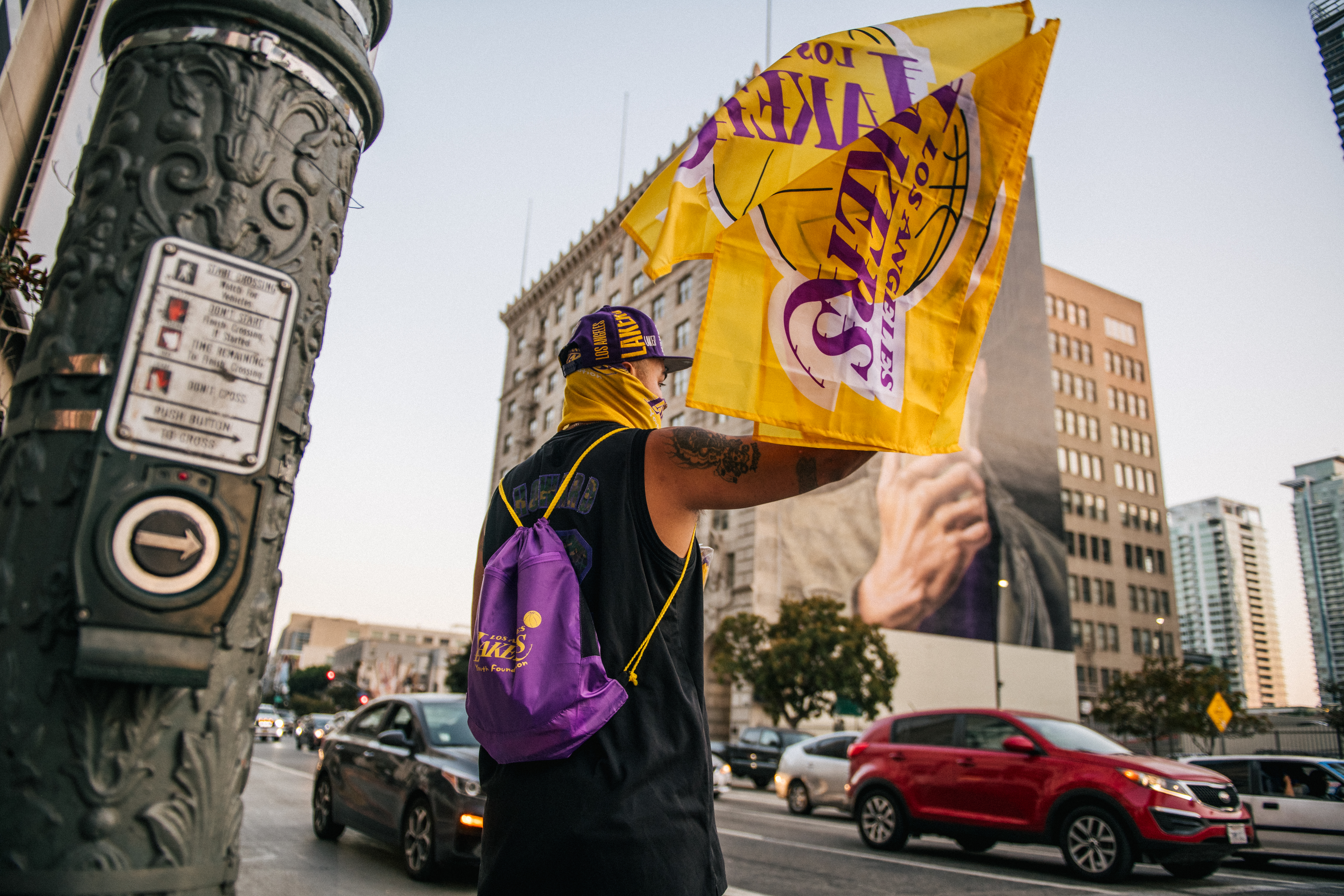 A man sells Lakers merchandise outside of the Staples Center on Oct. 11, 2020 in Los Angeles. (Brandon Bell/Getty Images)