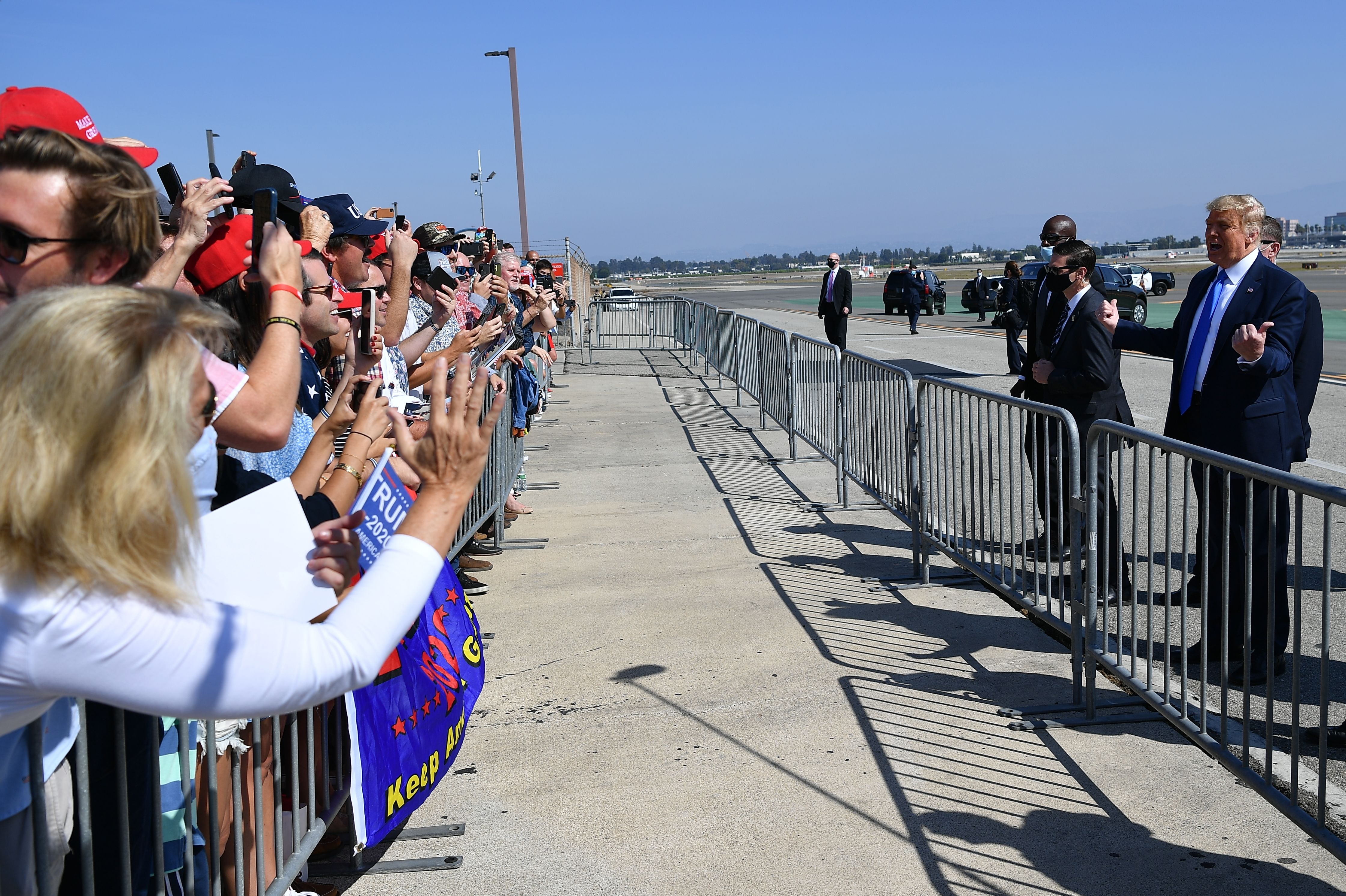 Donald Trump speaks to supporters after stepping off Air Force One upon arrival at John Wayne Airport in Santa Ana on Oct. 18, 2020. (MANDEL NGAN/AFP via Getty Images)