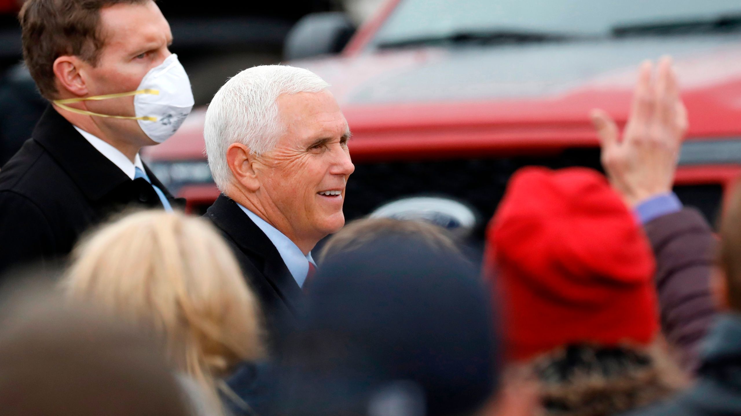 Vice President Mike Pence greets supporters after his "Make America Great Again!" campaign event at Oakland County International Airport in Waterford, Michigan, on Oct. 22, 2020. (JEFF KOWALSKY/AFP via Getty Images)