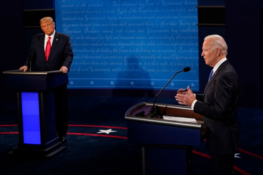 Democratic presidential candidate former Vice President Joe Biden answers a question as President Donald Trump listens during the second and final presidential debate at Belmont University in Nashville, Tennessee, on Oct. 22, 2020. (Morry Gash / Getty Images)