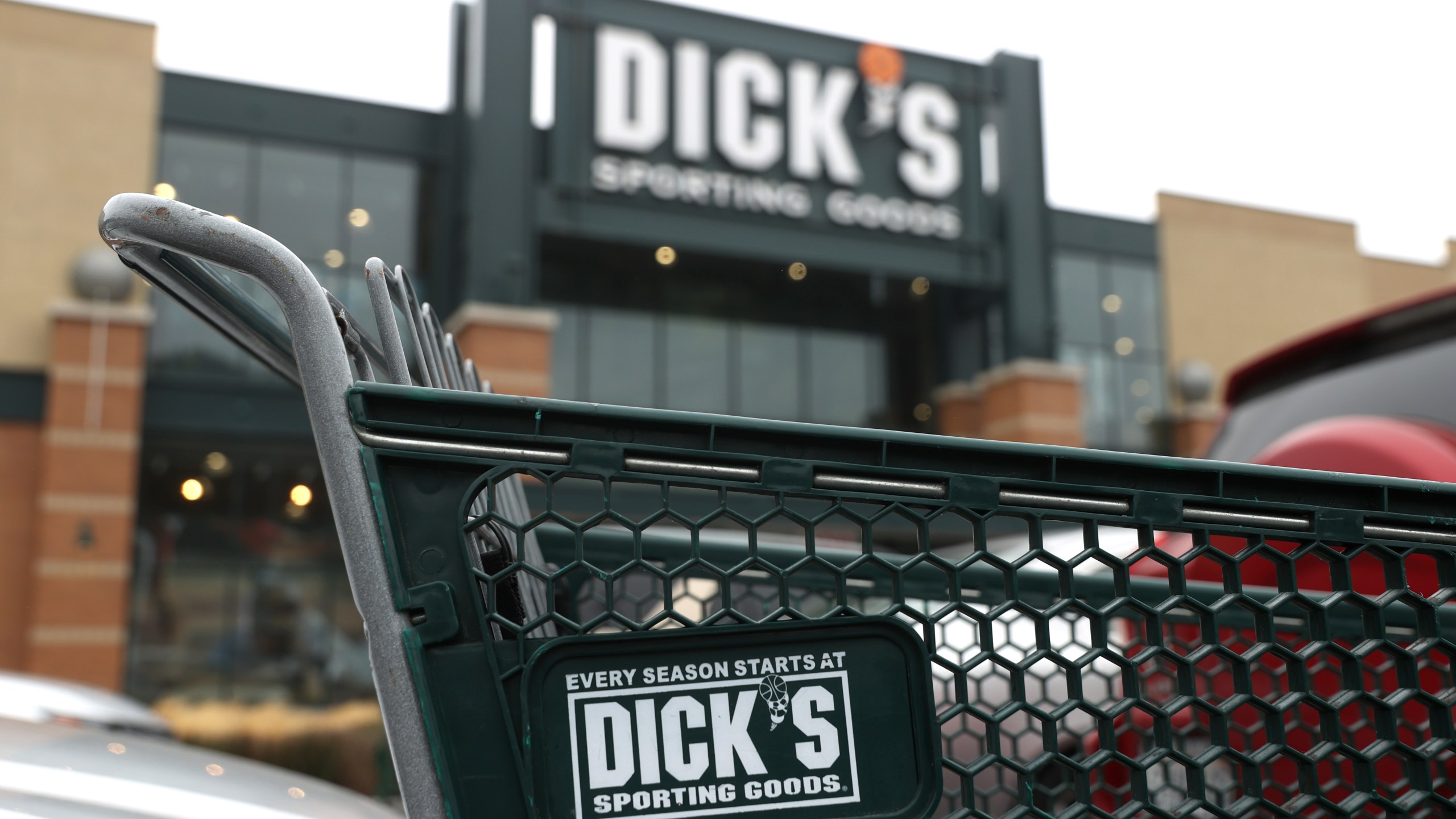 A shopping cart sits in front of a Dick's Sporting Goods store on Aug. 26, 2020. in Daly City, California. (Justin Sullivan/Getty Images)