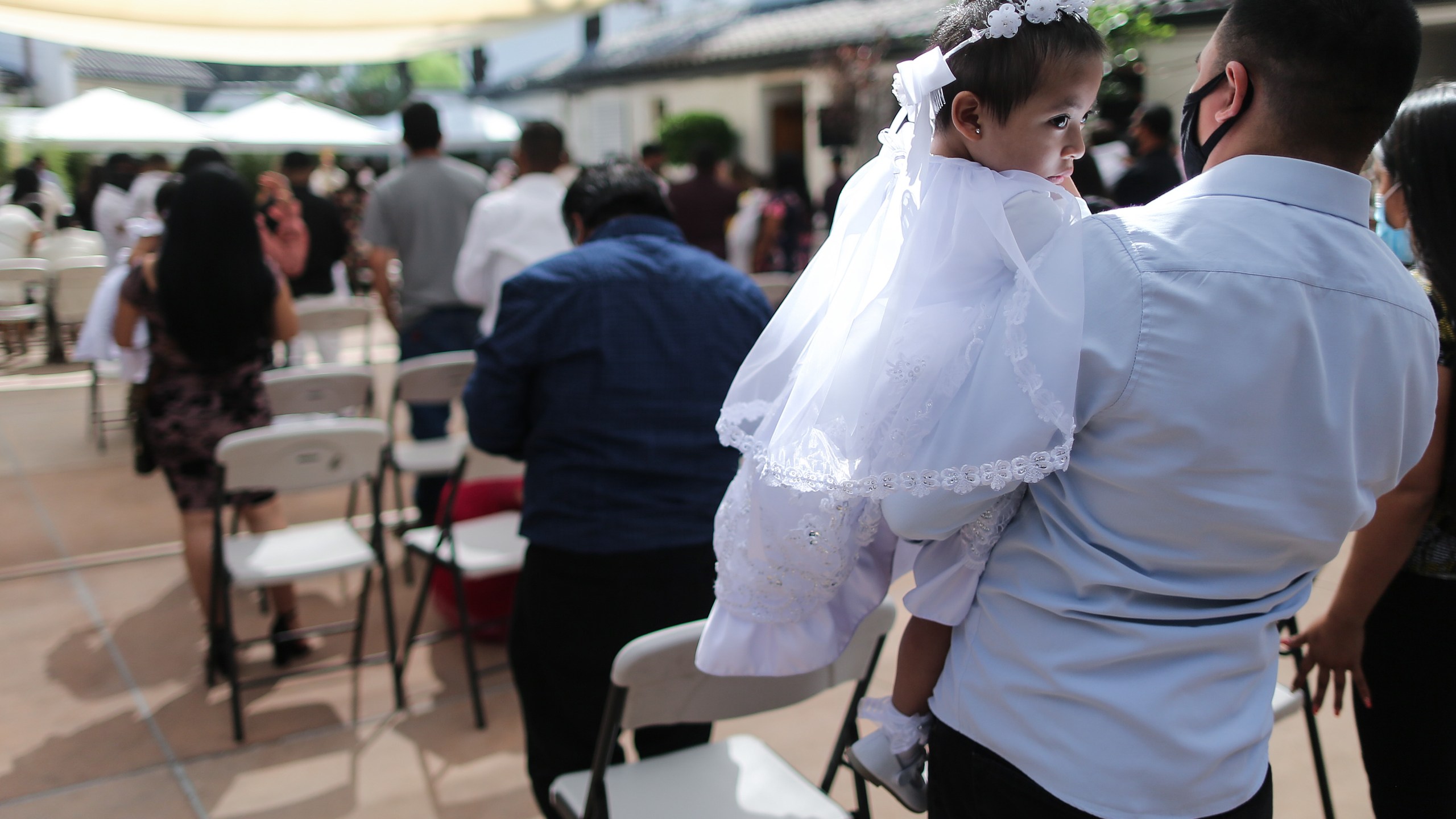 Worshippers gather for a baptism on Sept. 26, 2020 in Los Angeles, California. (Mario Tama/Getty Images)