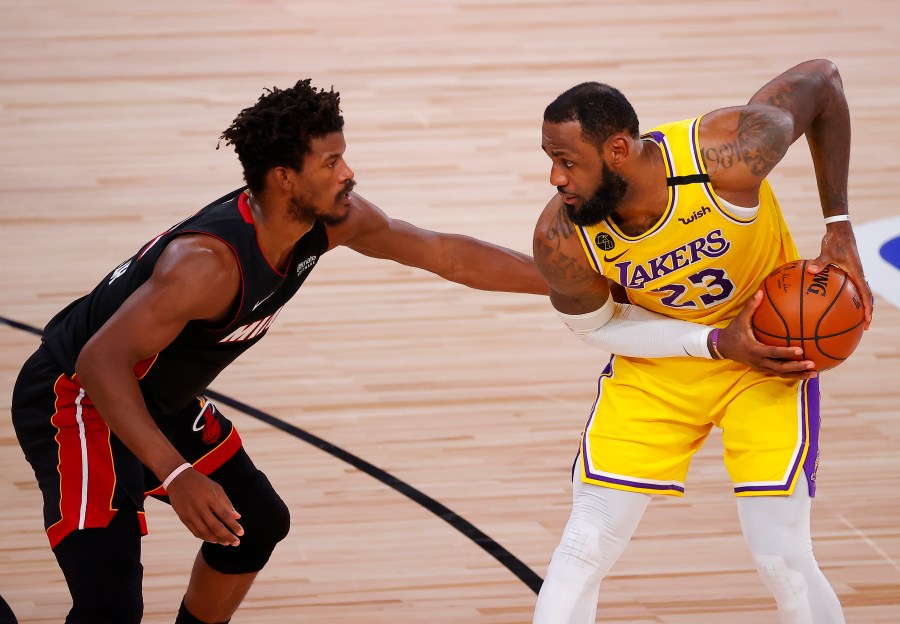 Jimmy Butler of the Miami Heat, left, defends LeBron James of the Los Angeles Lakers in Game Four of the 2020 NBA Finals in Florida on Oct. 6, 2020. (Kevin C. Cox / Getty Images)