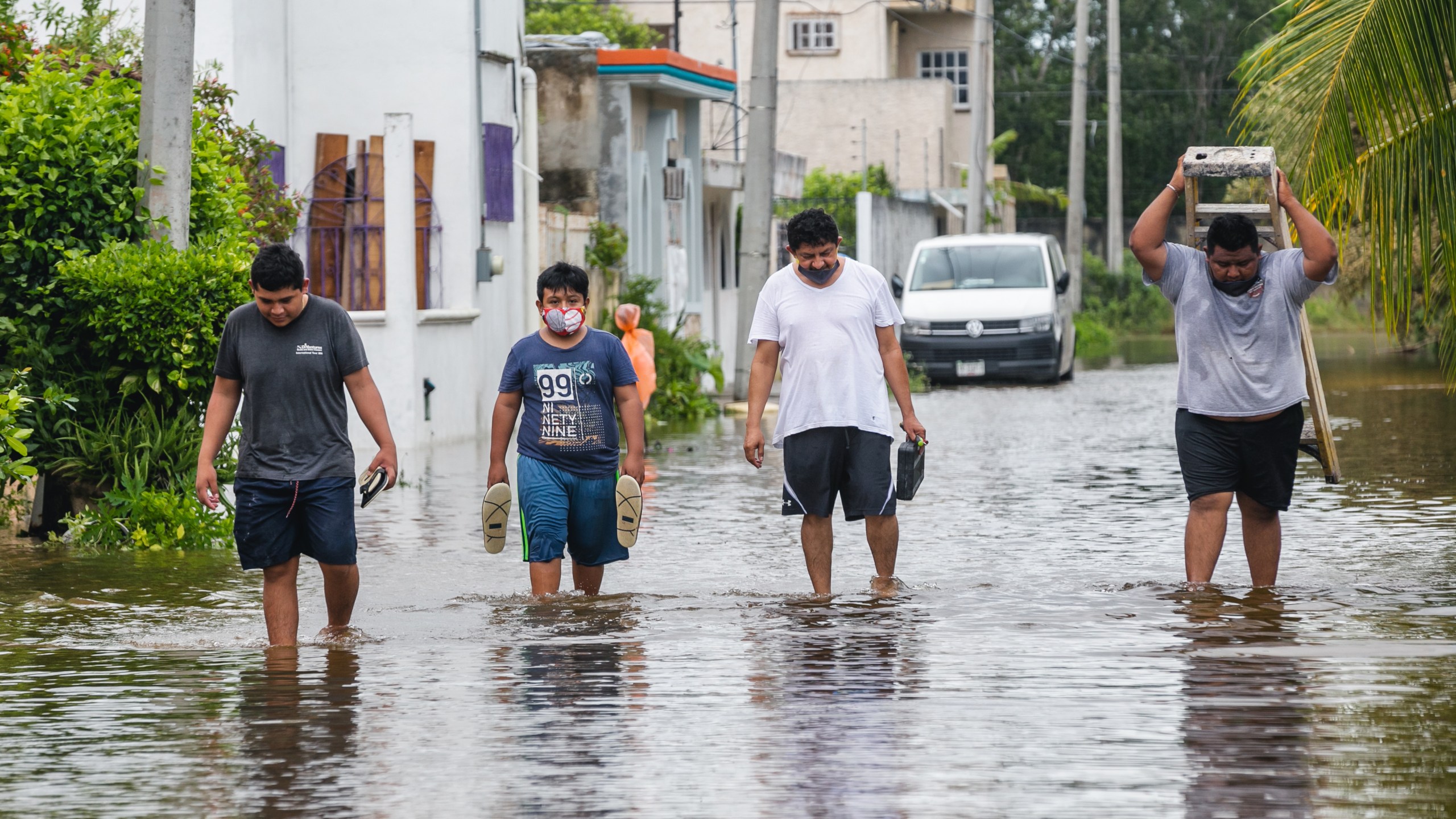 People walk on a flooded street after Hurricane Delta hit near Cozumel, Mexico, on Oct. 7, 2020. (Natalia Pescador / Getty Images)