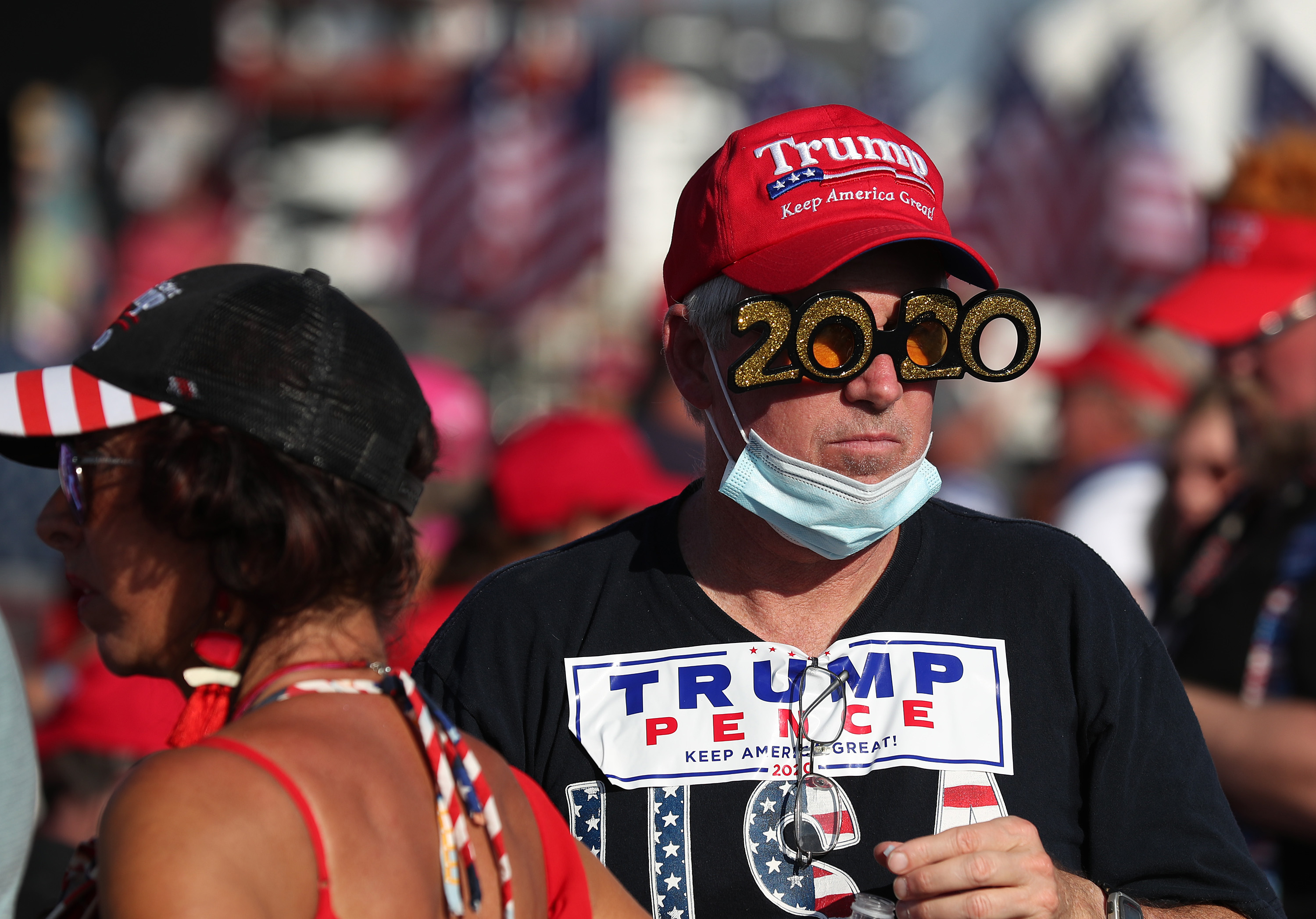 People wait for the start of a campaign rally for President Donald Trump at the Orlando Sanford International Airport on Oct. 12, 2020 in Sanford, Fla. Florida is a critical battleground state President Trump won by just over one percentage point in 2016. Currently, Trump is trailing Democratic nominee Joe Biden by an average of four percent in Florida. (Joe Raedle/Getty Images)