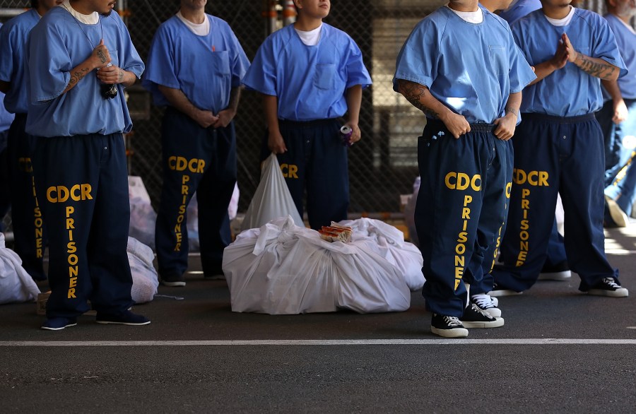 Inmates at San Quentin State Prison wait in line on August 15, 2016 in San Quentin, California. (Photo by Justin Sullivan/Getty Images)