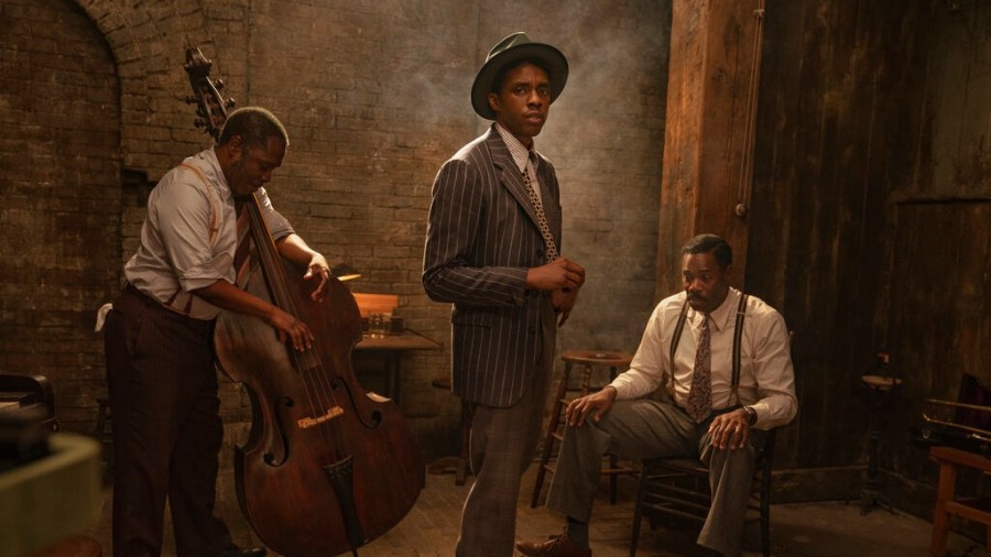 This image released by Netflix shows from left, Michael Potts, Chadwick Boseman and Colman Domingo in "Ma Rainey's Black Bottom." Netflix on Monday previewed George C. Wolfe’s August Wilson adaptation “Ma Rainey’s Black Bottom,” showcasing Chadwick Boseman’s final performance opposite Viola Davis’ powerhouse blues singer. (David Lee/Netflix via AP)