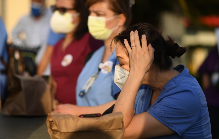 Nurses attend a candlelight vigil for nurse Celia Marcos outside Hollywood Presbyterian Medical Center in Los Angeles Wednesday. Marcos died from the coronavirus.(Wally Skalij / Los Angeles Times)