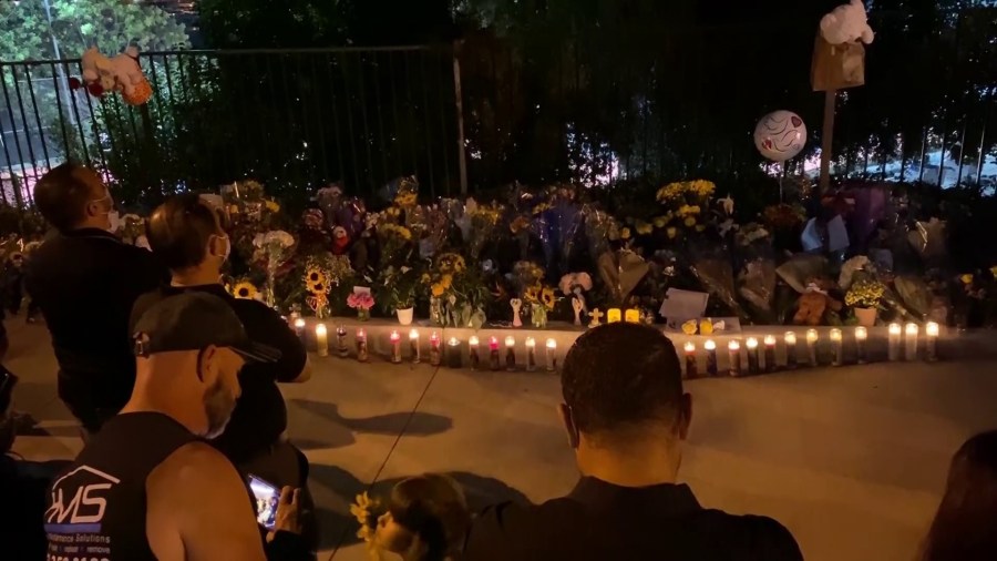 Mourners gathered at a makeshift memorial on Sept. 30, 2020, for two boys who died after being struck by a vehicle in Westlake Village. (KTLA)