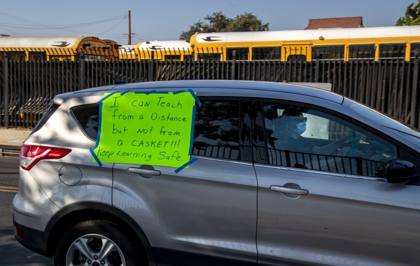 Teachers participate this month in a car caravan protest, asserting that the Compton Unified School District is not doing enough to keep them safe. District officials insist otherwise.(Gina Ferazzi / Los Angeles Times)