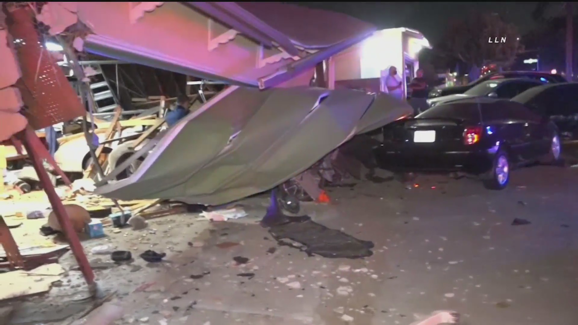 A car crashed into a home near Workman and Hollenbeck avenues in Covina on Oct. 10, 2020. (Loudlabs)