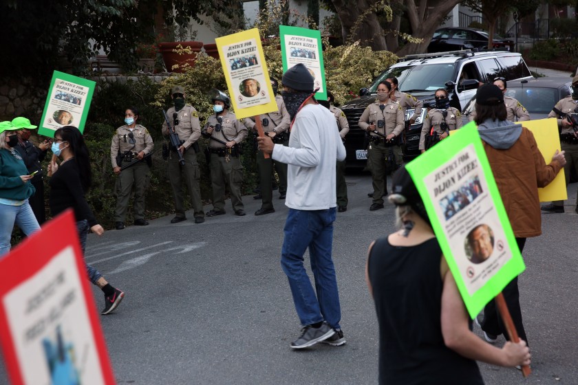 Protesters are seen outside L.A. County Sheriff Alex Villanueva’s La Habra Heights home on Nov. 18, 2020. (Dania Maxwell / Los Angeles Times)