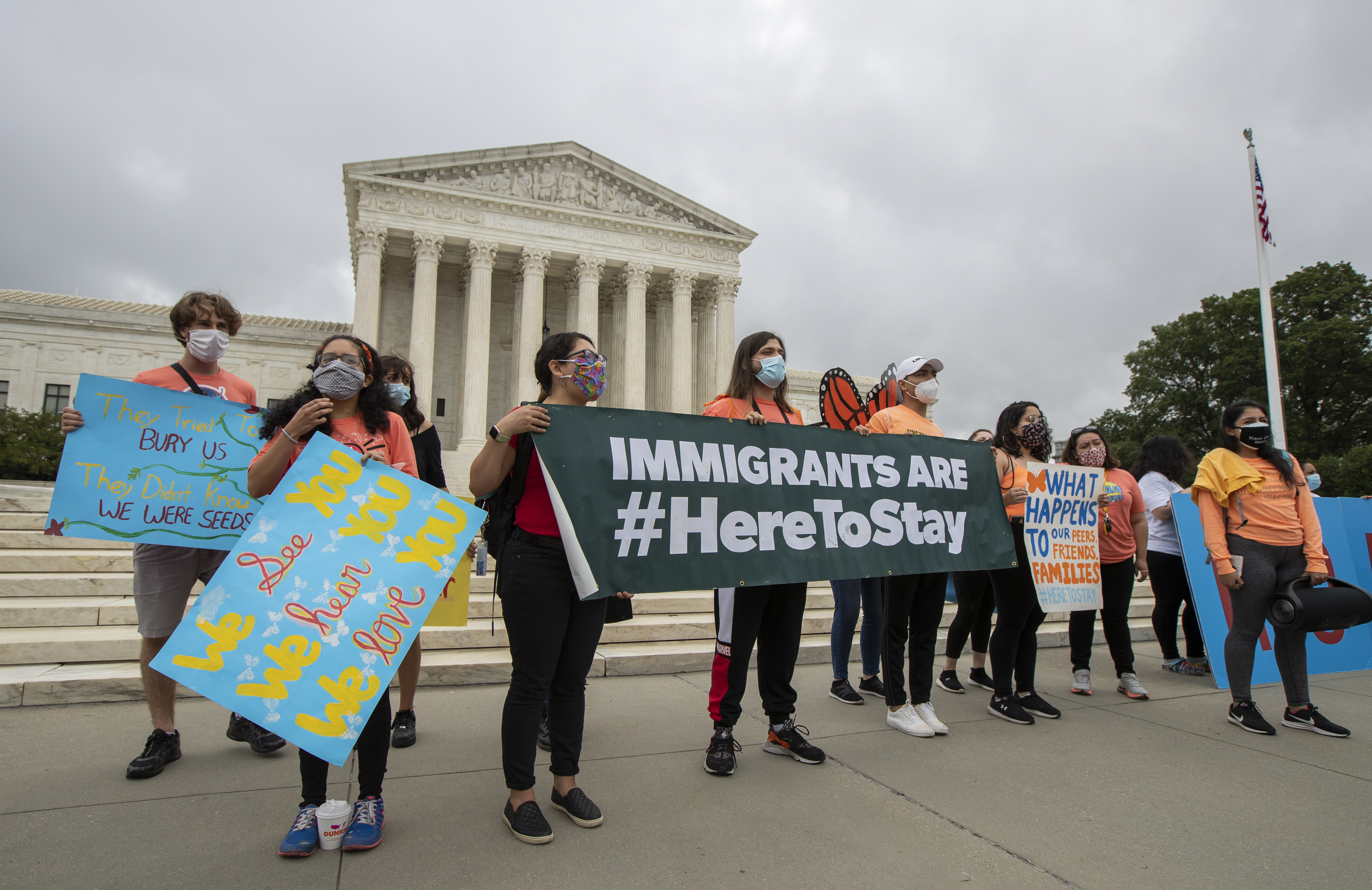 In this June 18, 2020, photo, Deferred Action for Childhood Arrivals (DACA) students celebrate in front of the Supreme Court after the Supreme Court rejected President Donald Trump's effort to end legal protections for young immigrants. (Manuel Balce Ceneta / Associated Press)