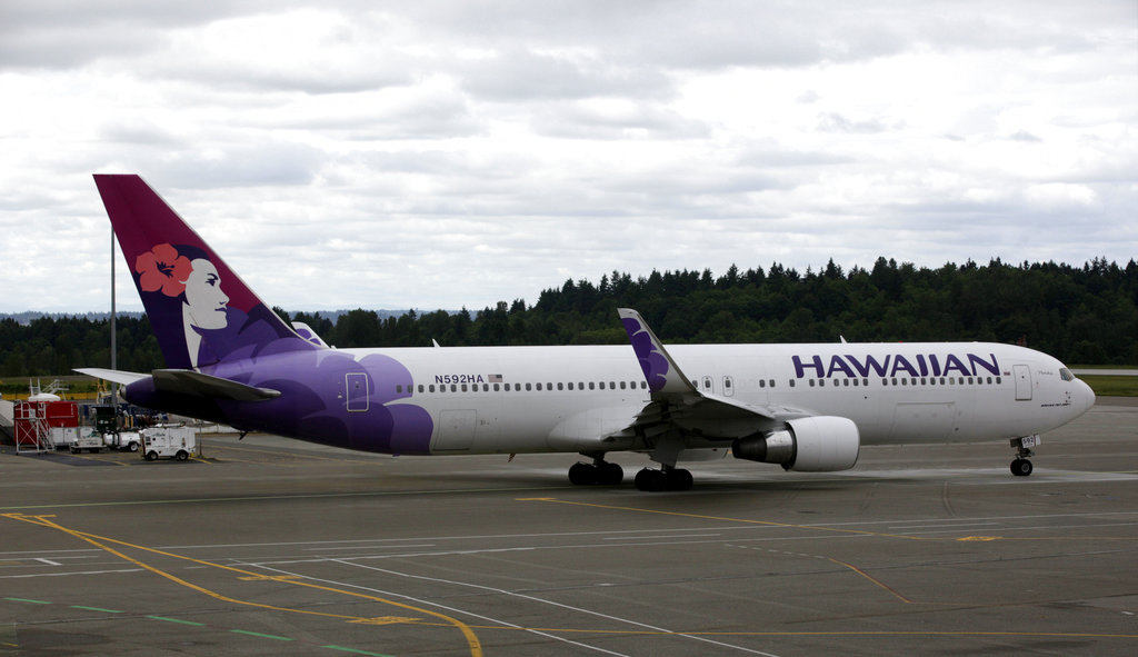 In this June 7, 2010 file photo an Hawaiian Airlines plane is shown at Seattle-Tacoma International Airport in Seattle. (AP Photo/Ted S. Warren, File)