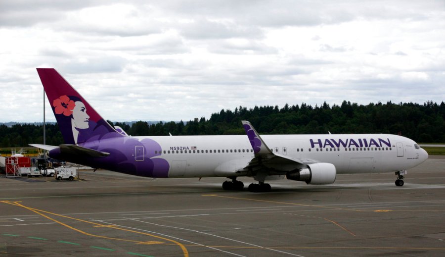 In this June 7, 2010 file photo an Hawaiian Airlines plane is shown at Seattle-Tacoma International Airport in Seattle. (AP Photo/Ted S. Warren, File)