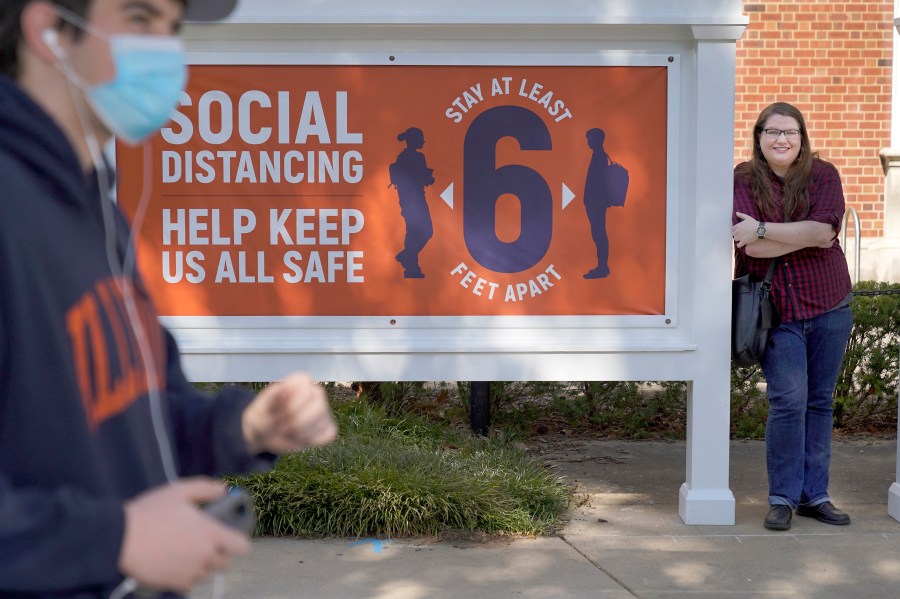 University of Illinois student Sarah Keeley, right, poses for a portrait on the college campus in Urbana, Ill., on Oct. 6, 2020. (AP Photo/Charles Rex Arbogast)