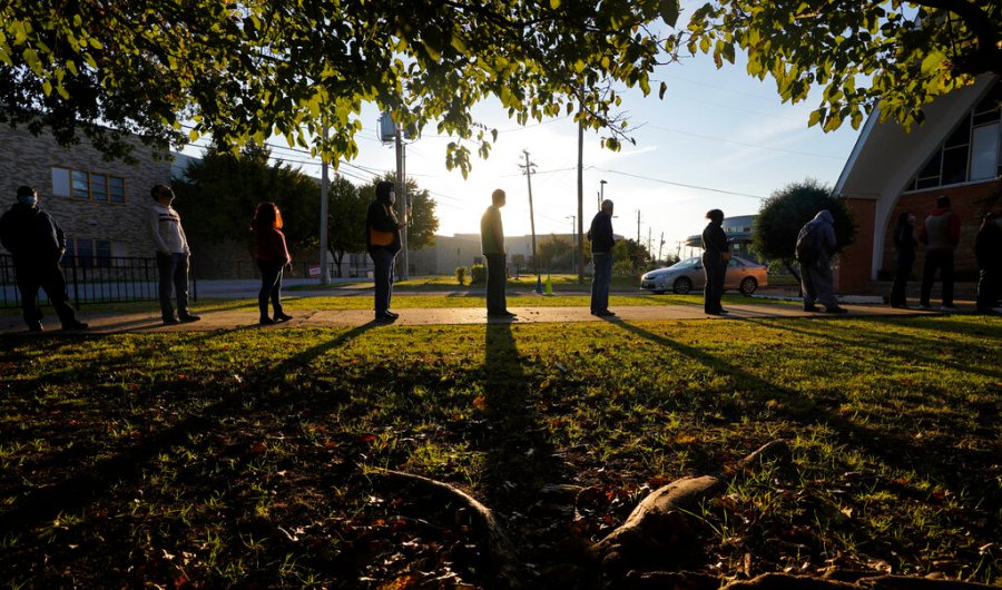 Voters line up outside Vickery Baptist Church waiting to cast their ballots on Election Day Tuesday, Nov. 3, 2020, in Dallas. (AP Photo/LM Otero)