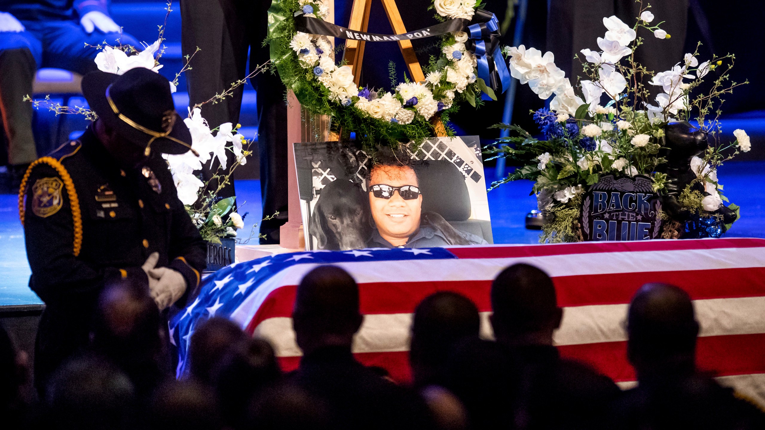 A picture of slain Newman police Cpl. Ronil Singh rests atop the casket during his funeral in Modesto on Jan. 5, 2019. (Noah Berger / Associated Press)