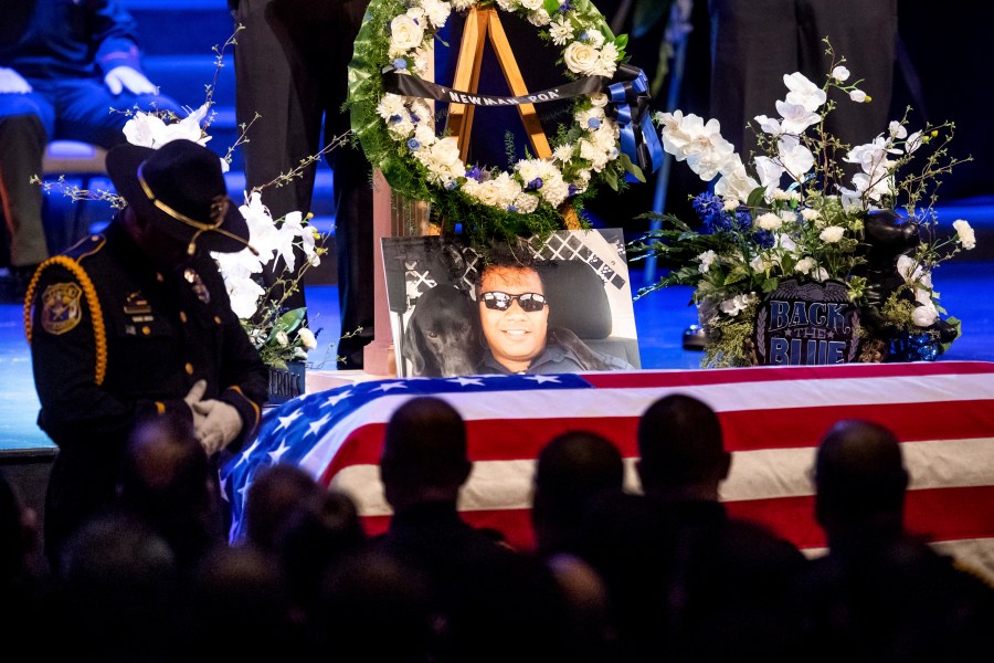 A picture of slain Newman police Cpl. Ronil Singh rests atop the casket during his funeral in Modesto on Jan. 5, 2019. (Noah Berger / Associated Press)