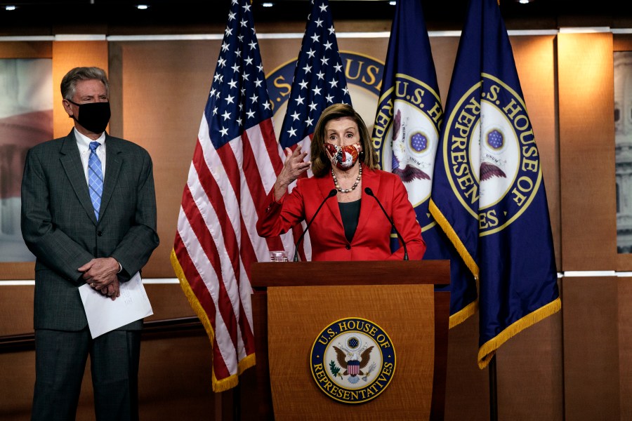 Speaker of the House Nancy Pelosi, D-Calif., talks to reporters about the impact of the election on the political landscape in Congress, at the Capitol in Washington, on Nov. 6, 2020. She is joined at left by House Energy and Commerce Chairman Frank Pallone, D-N.J. (J. Scott Applewhite / Associated Press)