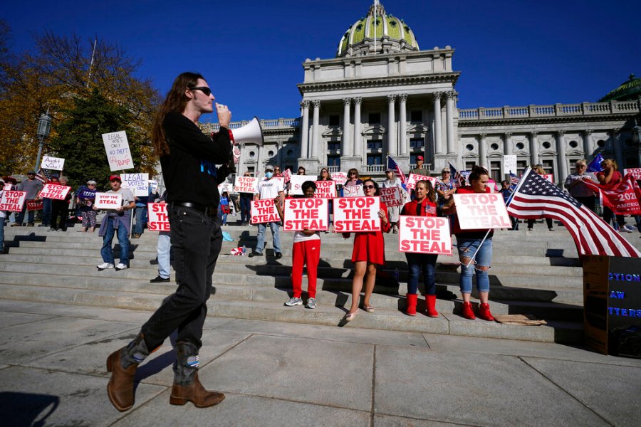 People demonstrate outside the Pennsylvania State Capitol, Friday, Nov. 6, 2020, in Harrisburg, Pa., as vote counting continues following Tuesday's election. (AP Photo/Julio Cortez)