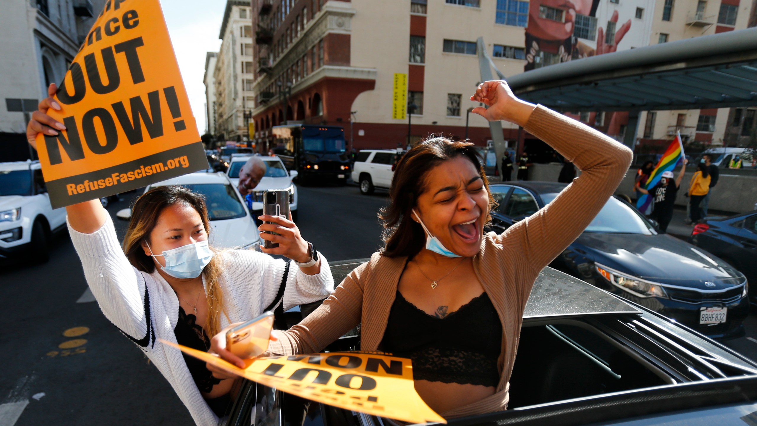 People celebrate the victory of President-elect Joe Biden and Vice President-elect Kamala Harris in Los Angeles, Saturday, Nov. 7, 2020. (AP Photo/Ringo H.W. Chiu)