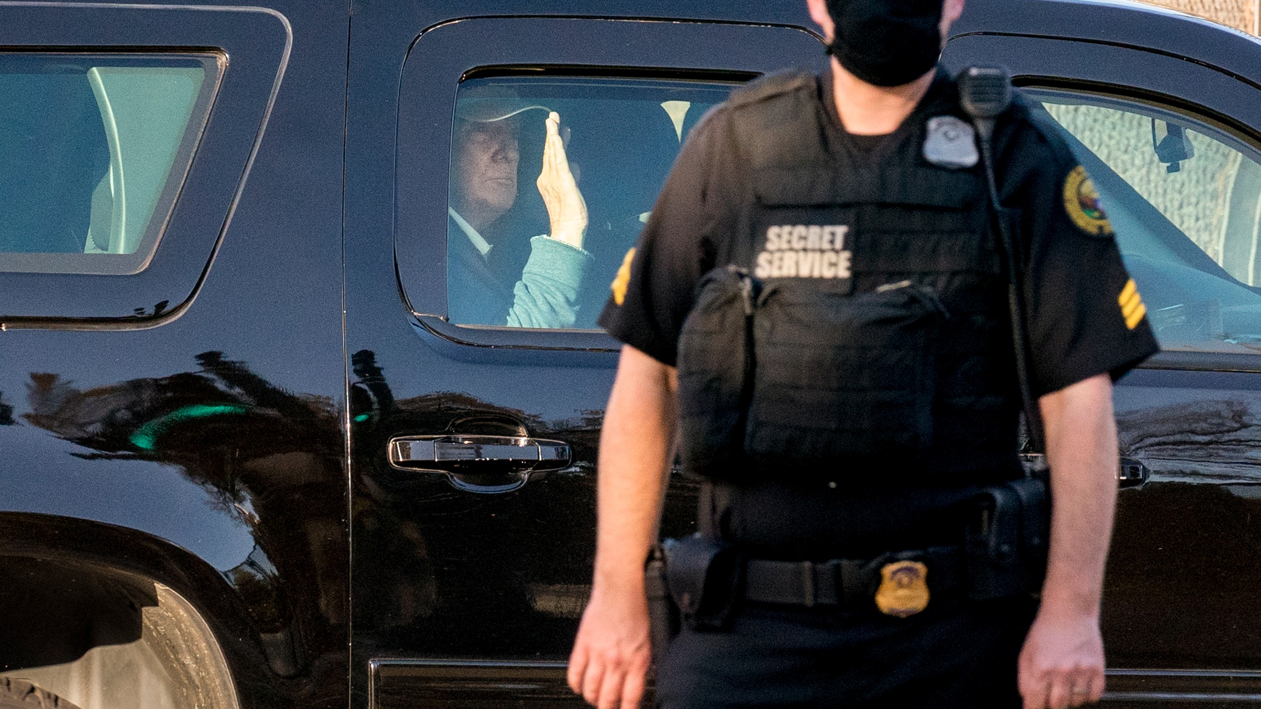 Donald Trump waves to supporters as his motorcade arrives at the White House after golfing at his Trump National Golf Club in Sterling, Va., in Washington, Sunday, Nov. 8, 2020, a day after was defeated by President-elect Joe Biden. (AP Photo/J. Scott Applewhite)