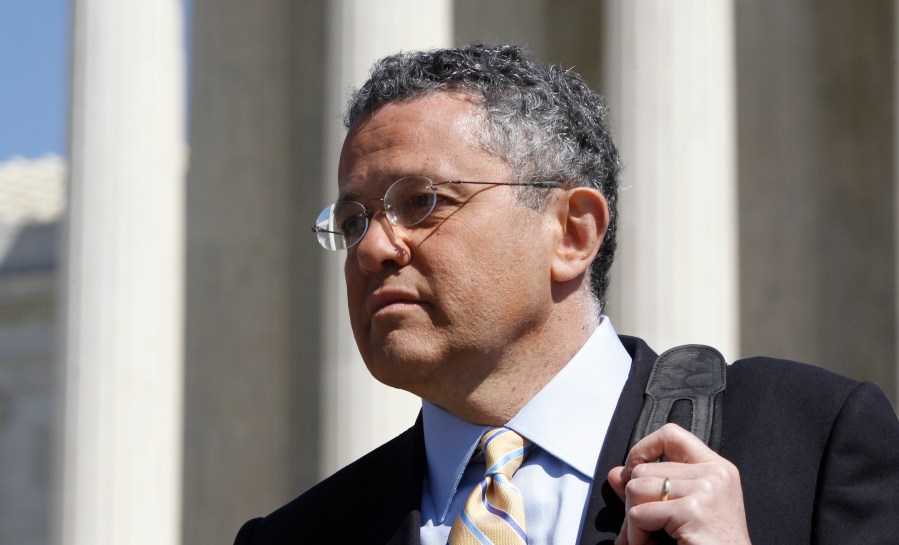 Jeffrey Toobin leaves the Supreme Court after it finished the day's arguments on the health care law signed by President Barack Obama in Washington on March 27, 2012. The New Yorker has parted ways with longtime staff writer Toobin after he reportedly exposed himself during a Zoom conference last month. He had already been on suspension and is also on leave from CNN, where he has been a legal commentator. (AP Photo/Charles Dharapak/Associated Press)