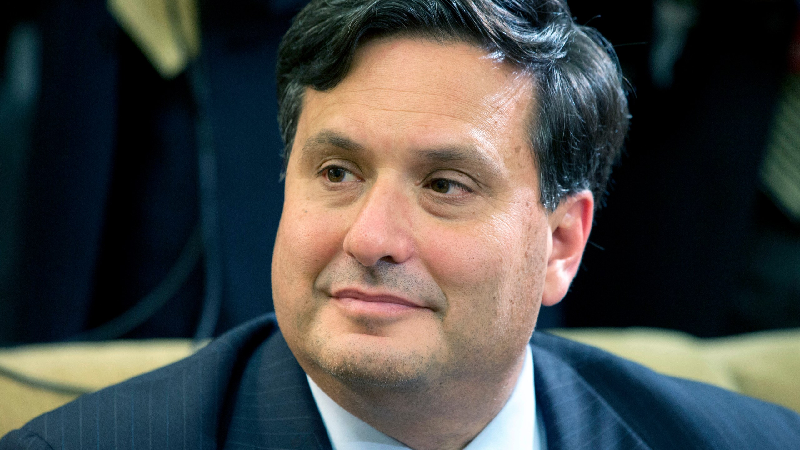 In this Oct. 22, 2014, file photo, Ron Klain listens as President Barack Obama speaks to the media about the government's Ebola response in the Oval Office of the White House in Washington. (AP Photo/Jacquelyn Martin, File)