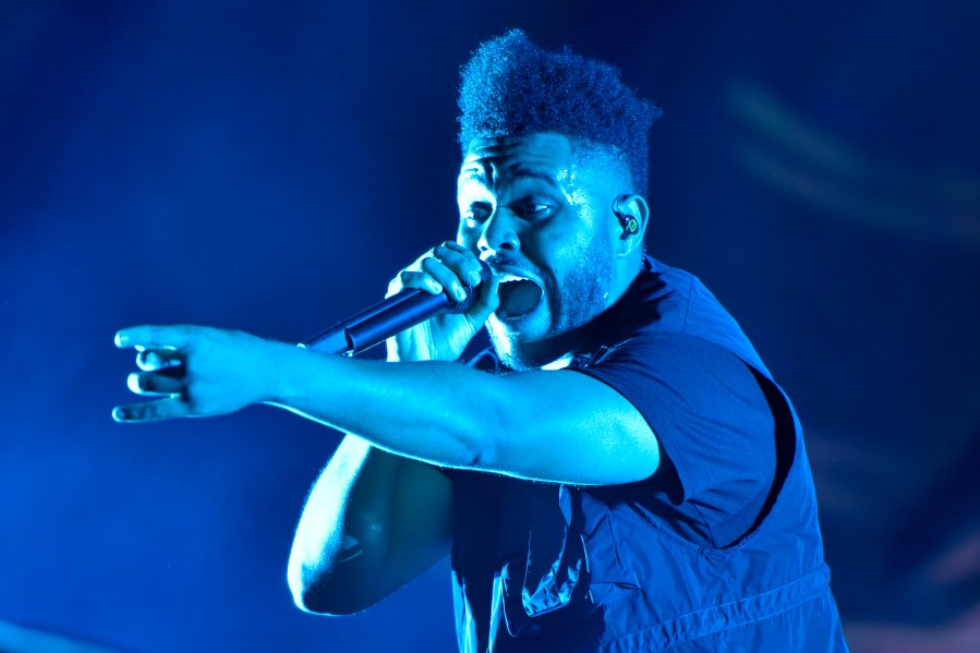 The Weeknd performs on day three at Lollapalooza in Chicago on Aug 4, 2018. The NFL, Pepsi and Roc Nation announced Thursday, Nov. 12 that the three-time Grammy winner will perform at the 2021 Pepsi Super Bowl Halftime Show on Feb. 7 at Raymond James Stadium in Tampa, Florida. (Photo by Rob Grabowski/Invision/AP, File)